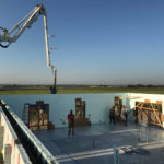 Pumping concrete wall on a rural project